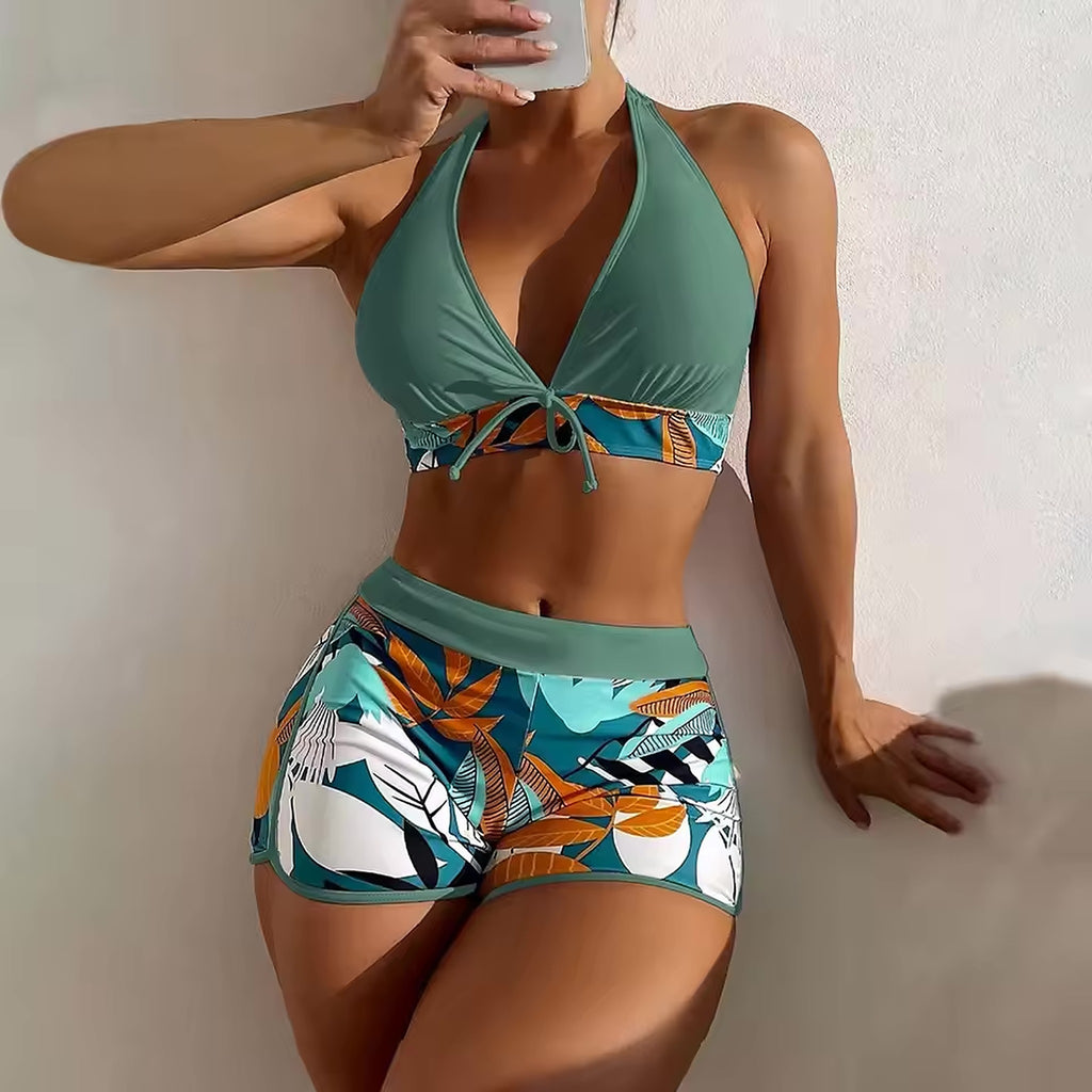Sage green halter bikini top with tropical leaf print tie-side bottom and coordinating waistband detail
