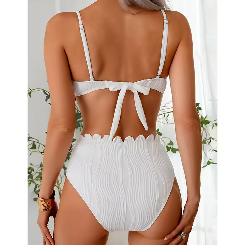 White tie-back bikini top with scalloped high-waisted bottom, textured fabric detail
