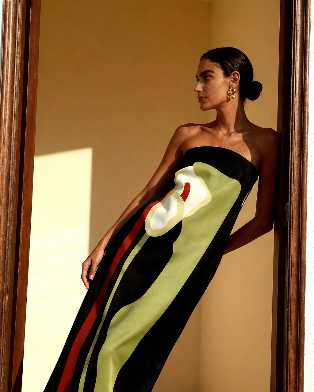Black bandeau bikini with bold green, red, and white color-blocking stripe design