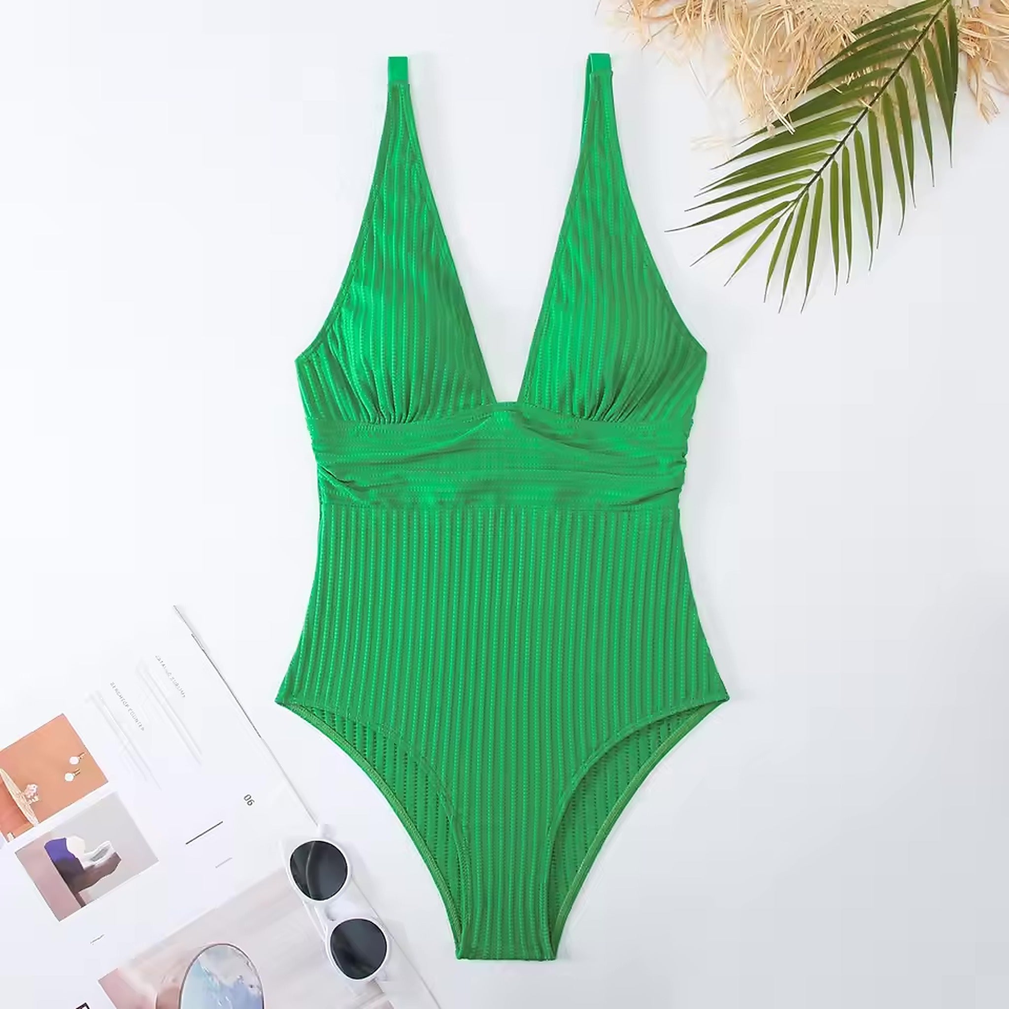 Green ribbed one-piece swimsuit with plunging neckline and wrap waist detail