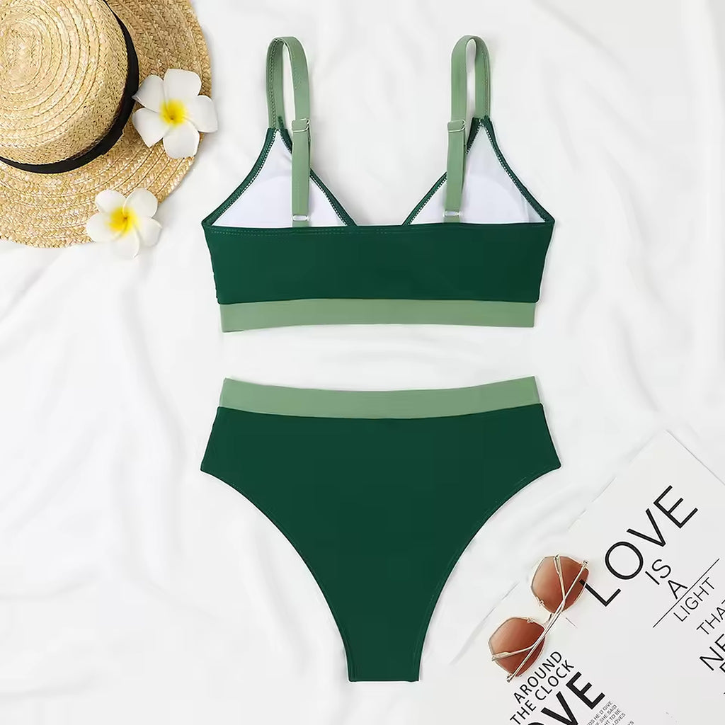 Forest green two-piece bikini with sage stripe detail and adjustable straps, styled with straw hat and summer accessories.