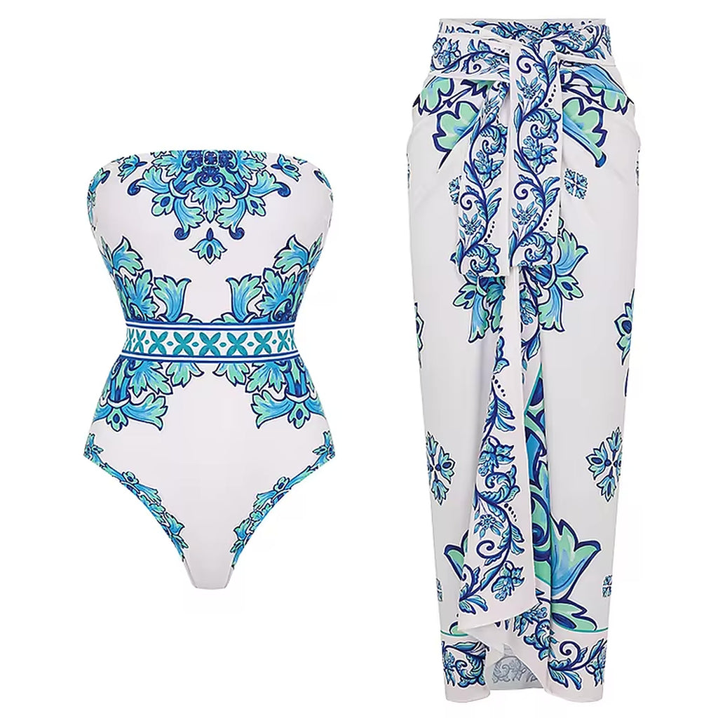 Blue and turquoise ornate patterned swimsuit with matching cover-up sarong in white.