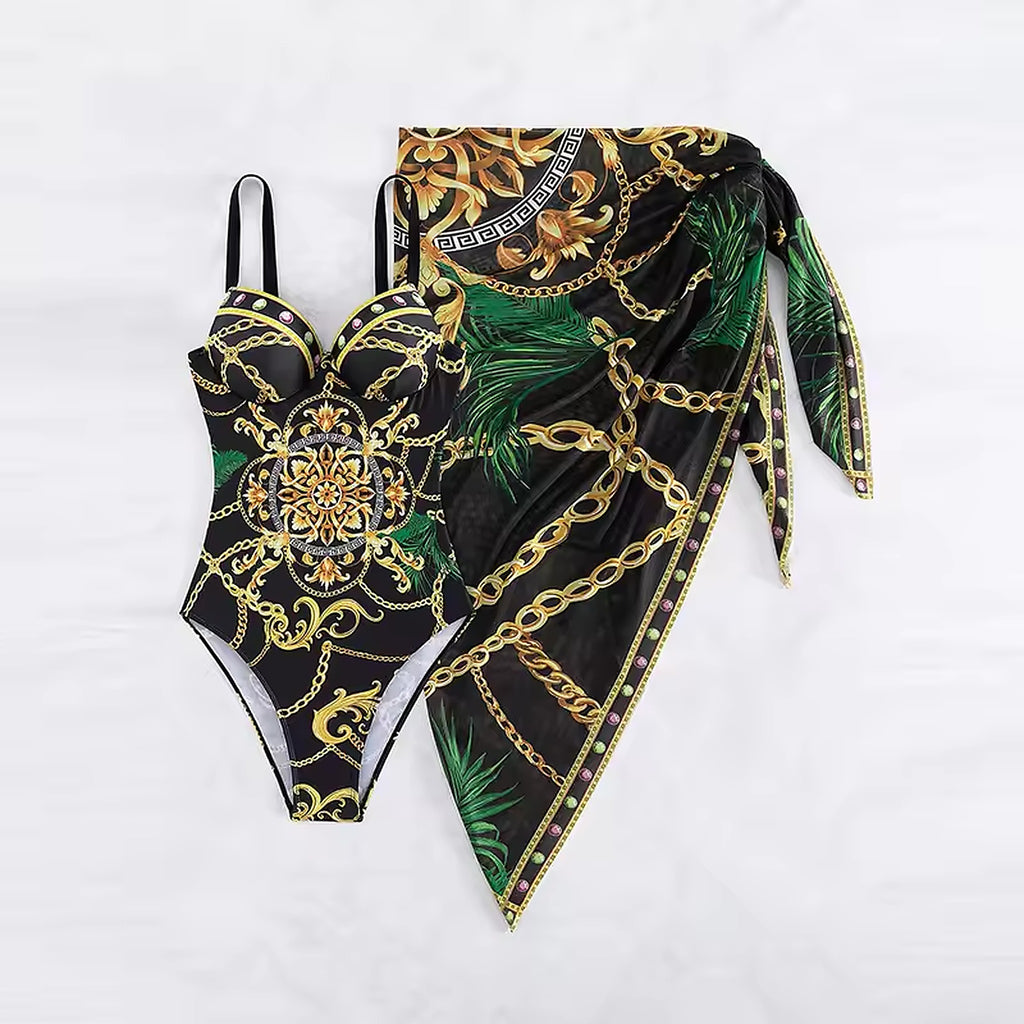 Black bikini with gold chain and baroque print, green palm leaves, matching wrap sarong with tie details