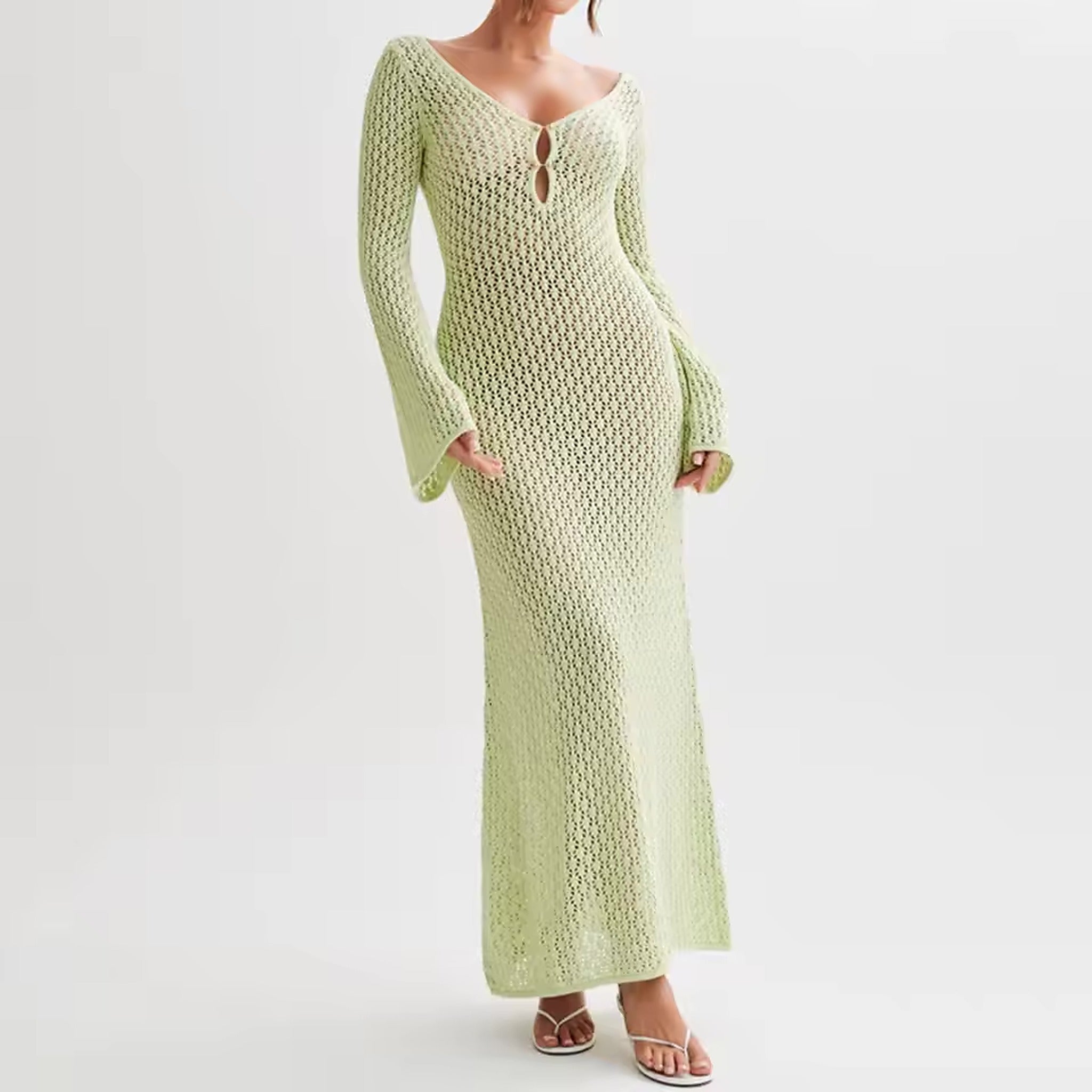 Woman wearing pale green crochet swimwear cover-up dress with long bell sleeves and keyhole neckline detail