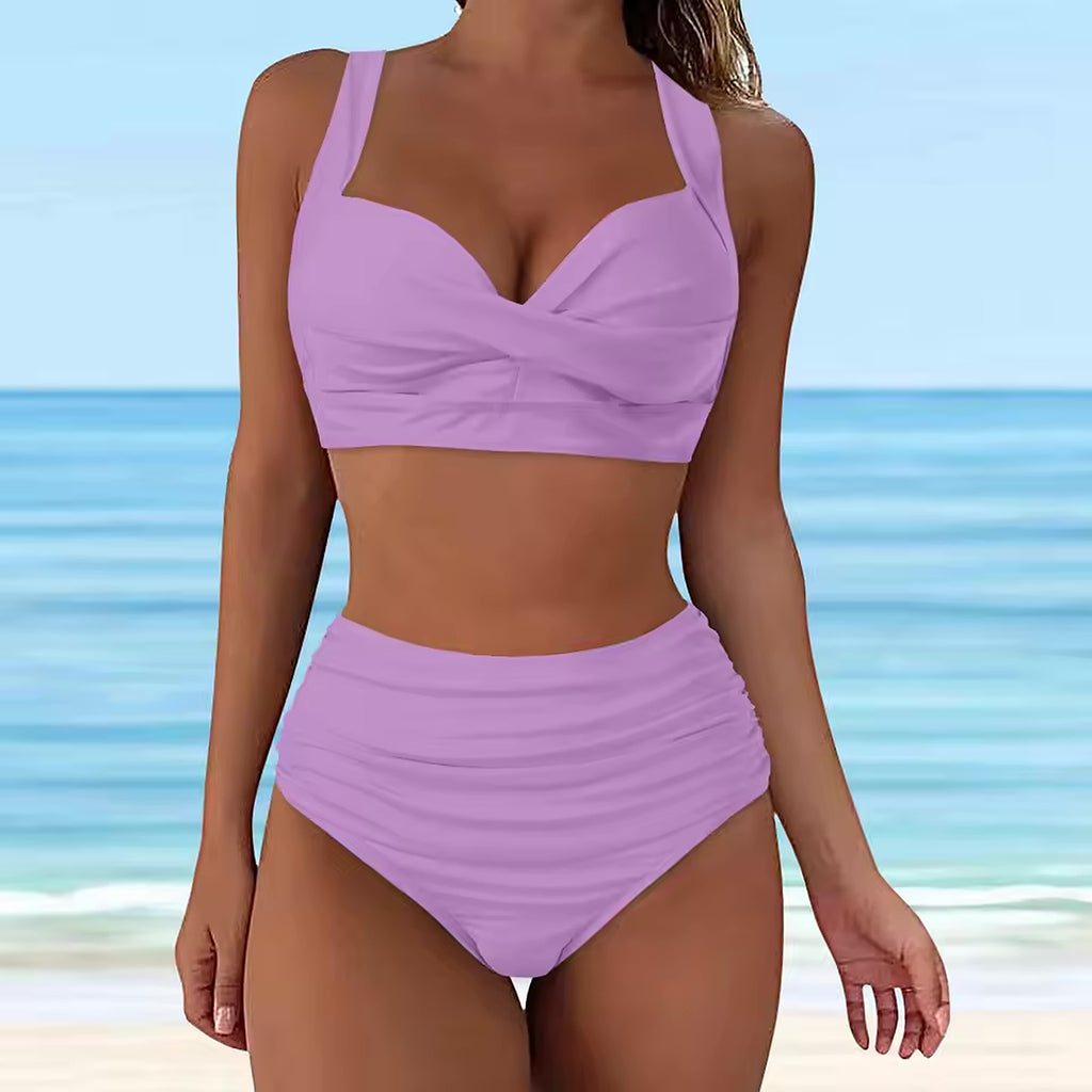Lavender wrap bikini top and high-waisted ruched bikini bottom with ocean and beach background